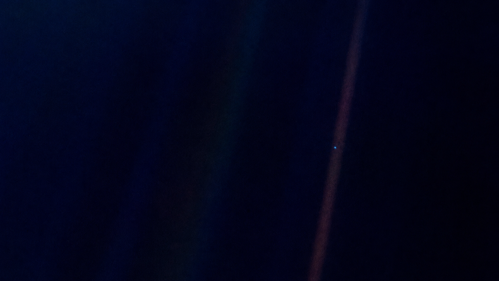 O planeta Terra visto do espaço sem fronteiras visíveis contrastando com a imensidão escura do cosmos.
